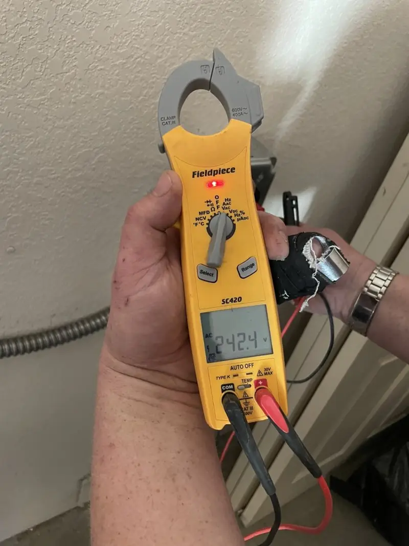 Voltage testing with clamp meter during Outlet Installation in South Greeley